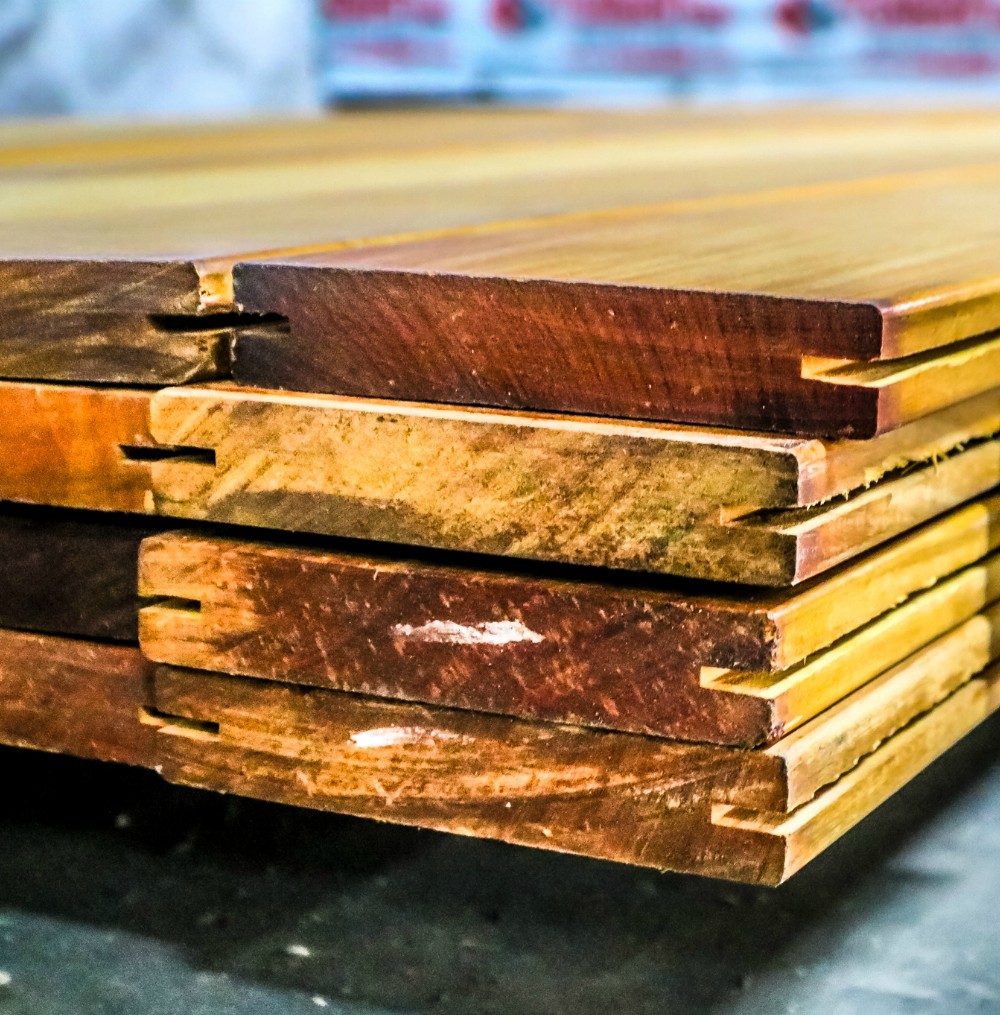 Ipe tongue and groove and pre-grooved profiles stacked in warehouse